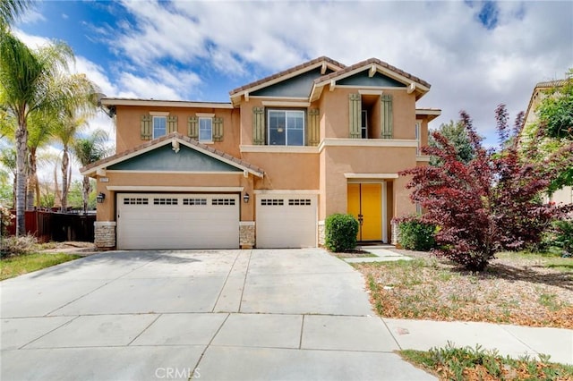 view of front of home featuring a garage, stucco siding, concrete driveway, and stone siding