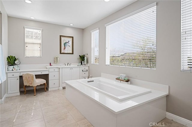 full bathroom with baseboards, recessed lighting, and plenty of natural light