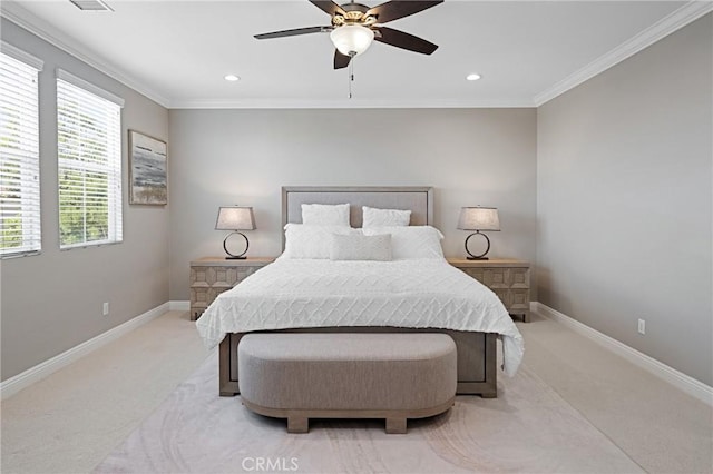 bedroom with crown molding, baseboards, and light colored carpet