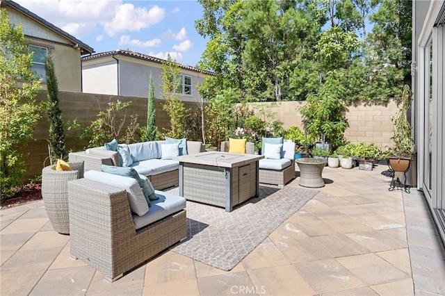 view of patio with outdoor lounge area and a fenced backyard