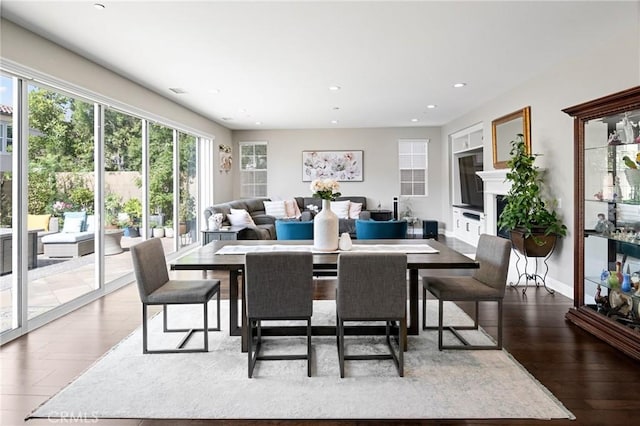dining space with recessed lighting and dark wood finished floors