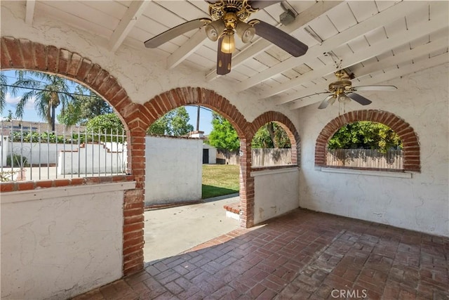 view of patio featuring fence and a ceiling fan