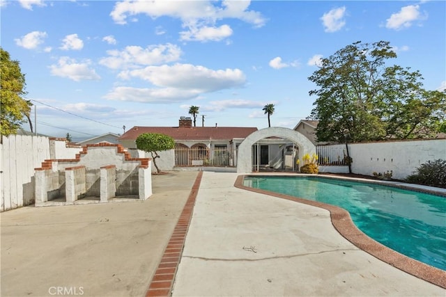 view of swimming pool featuring a fenced in pool, fence private yard, and a patio area