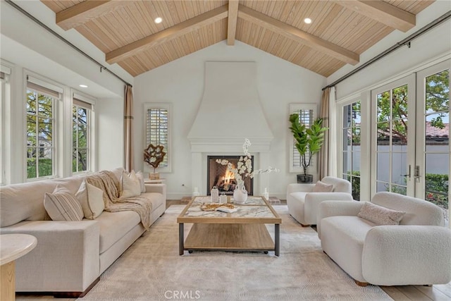 living room featuring wood ceiling, beamed ceiling, french doors, and high vaulted ceiling