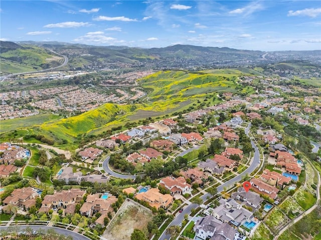drone / aerial view with a residential view and a mountain view