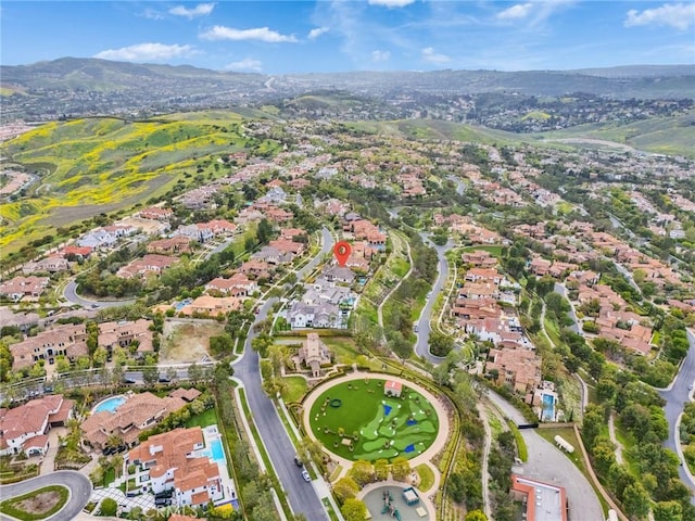 birds eye view of property featuring a mountain view and a residential view