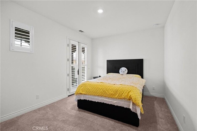 bedroom featuring access to outside, carpet flooring, baseboards, and multiple windows