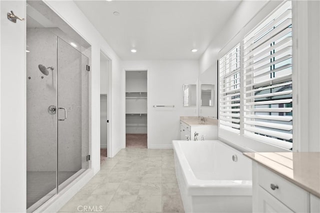 107 Frontier, Irvine, CA 92620 - full bath featuring a shower stall, vanity, a walk in closet, a bath, and recessed lighting