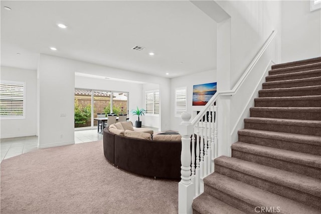 107 Frontier, Irvine, CA 92620 - living room with stairway, recessed lighting, light tile patterned floors, baseboards, and light carpet