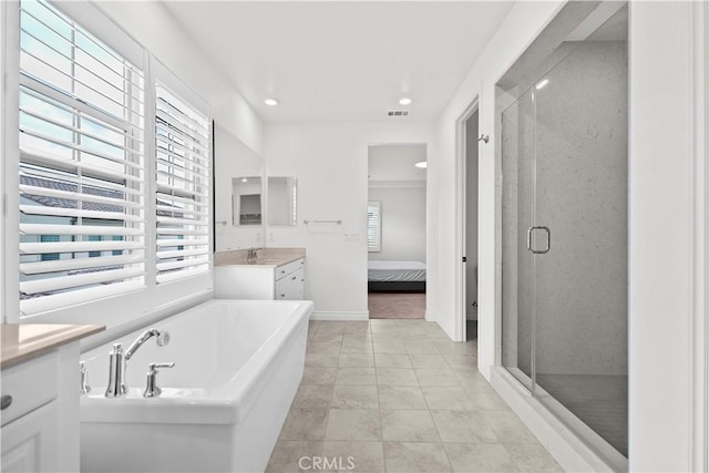 full bathroom featuring vanity, baseboards, connected bathroom, a bath, and a shower stall