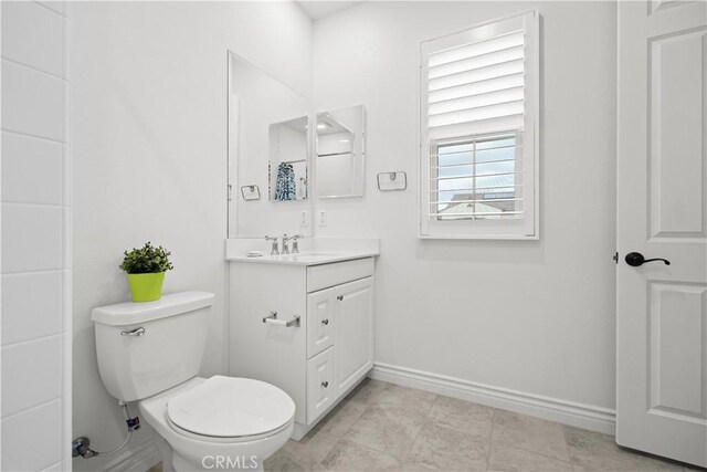 107 Frontier, Irvine, CA 92620 - bathroom with vanity, toilet, and baseboards