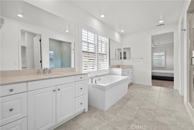 full bathroom featuring visible vents, a sink, recessed lighting, and a shower stall