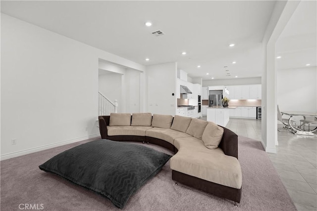 living room with recessed lighting, stairs, light tile patterned floors, and visible vents