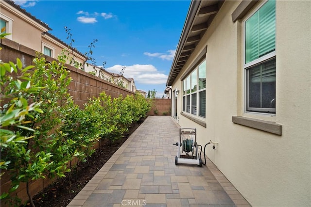 107 Frontier, Irvine, CA 92620 - fenced backyard with a patio area