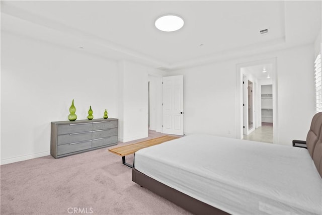 107 Frontier, Irvine, CA 92620 - carpeted bedroom with baseboards, a walk in closet, and a raised ceiling