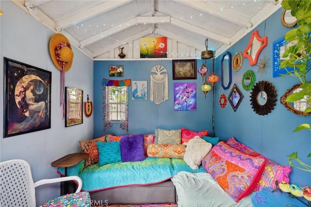 bedroom featuring vaulted ceiling with beams