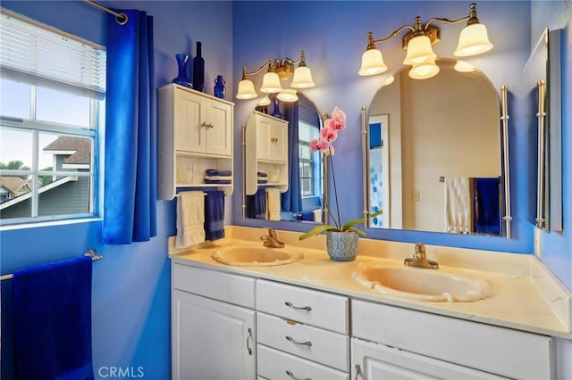 bathroom with double vanity and a sink