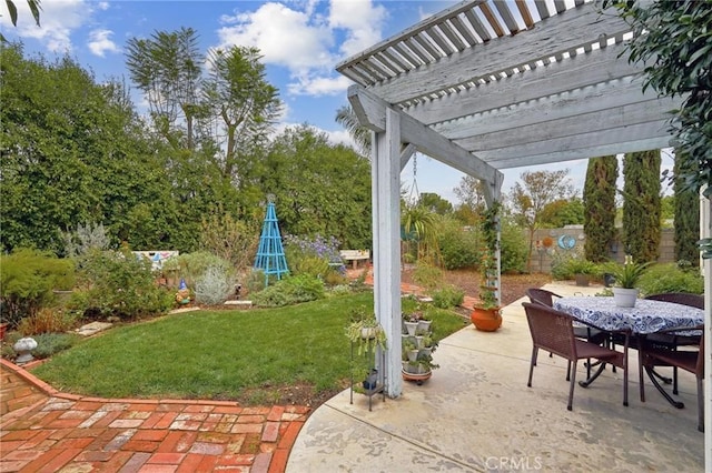 view of yard with a patio, fence, outdoor dining space, and a pergola