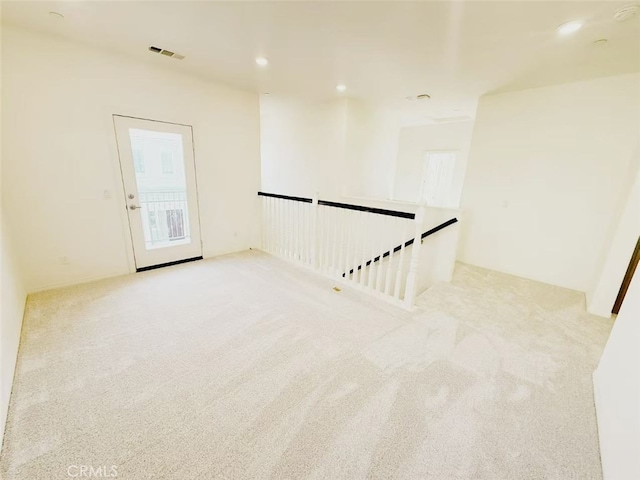 unfurnished room with carpet, recessed lighting, and visible vents