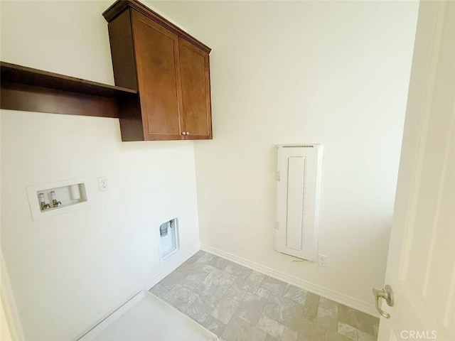 clothes washing area with cabinet space, baseboards, and hookup for a washing machine