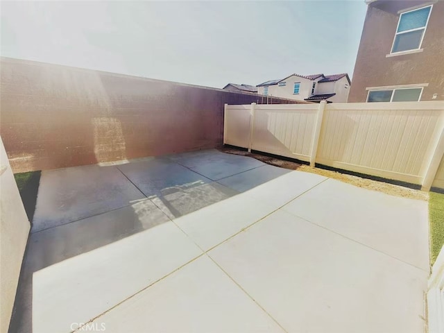 view of patio / terrace featuring fence