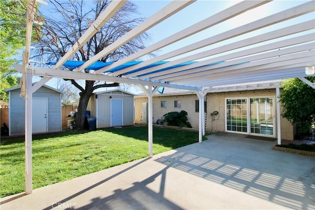 view of patio featuring an outdoor structure, a pergola, and a storage shed