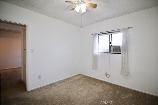 empty room with carpet floors, a ceiling fan, a textured ceiling, and cooling unit