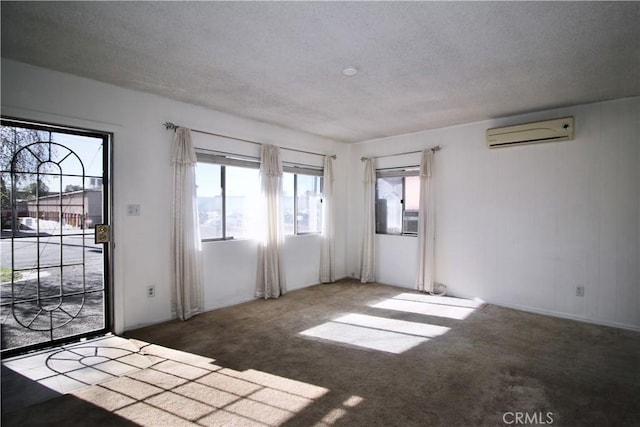 interior space featuring a wall mounted air conditioner, a healthy amount of sunlight, and carpet flooring