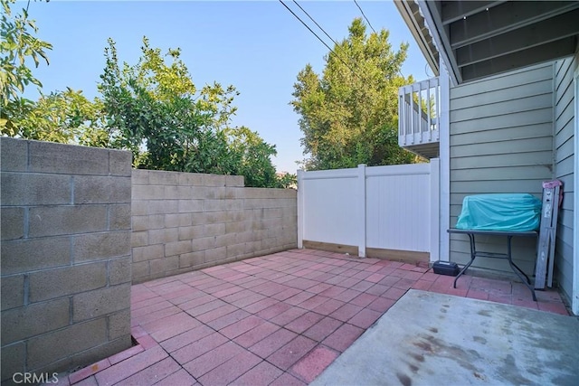view of patio featuring fence