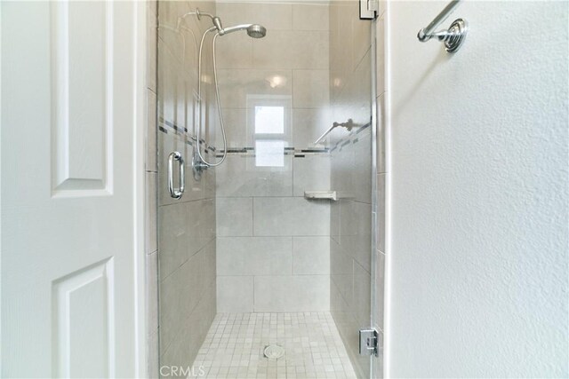 bathroom with a shower stall