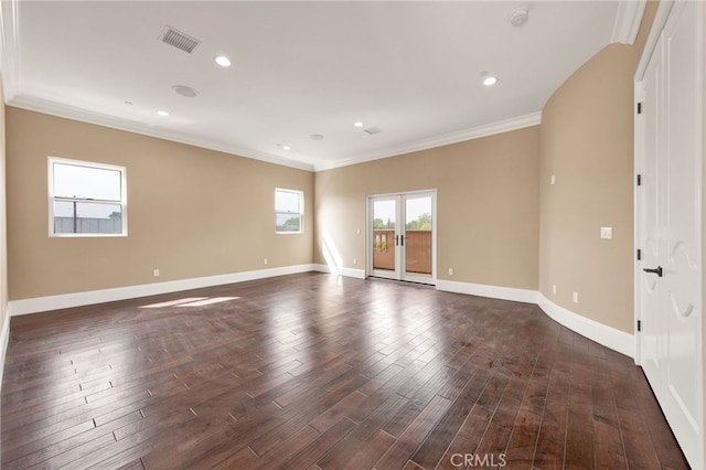spare room with visible vents, crown molding, dark wood-style flooring, baseboards, and recessed lighting