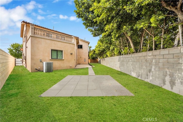 back of property with a fenced backyard, stucco siding, and cooling unit
