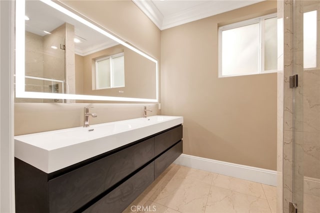 bathroom featuring a sink, ornamental molding, a shower stall, and marble finish floor