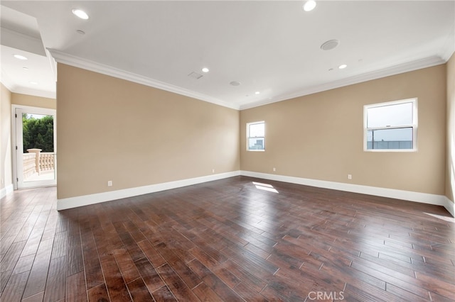 unfurnished room featuring baseboards, ornamental molding, and dark wood-style floors