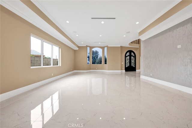 unfurnished living room featuring recessed lighting, marble finish floor, crown molding, and baseboards