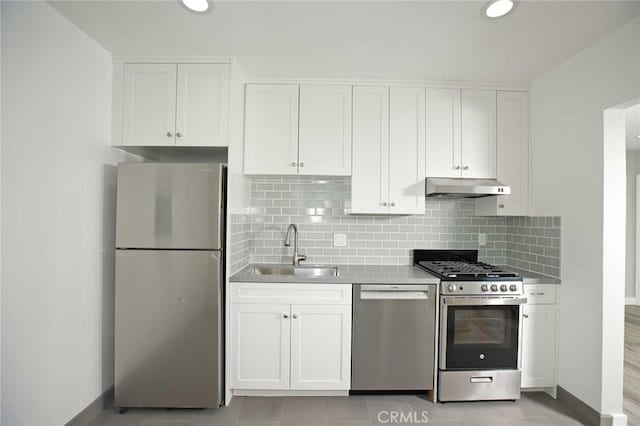 5459 Carlin St, Los Angeles, CA 90016 - kitchen featuring a sink, stainless steel appliances, white cabinetry, and under cabinet range hood
