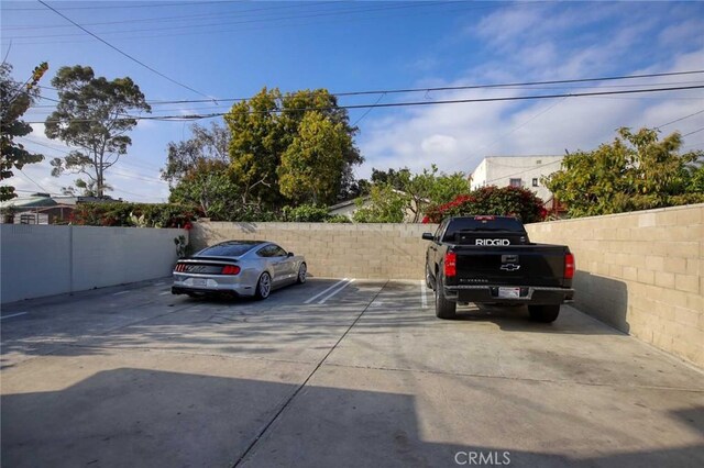 5459 Carlin St, Los Angeles, CA 90016 - uncovered parking lot with fence
