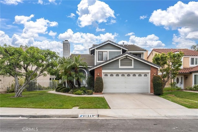 21340 Via Del Puma, Yorba Linda, CA 92887 - view of front of home with concrete driveway, a garage, a chimney, and a tile roof