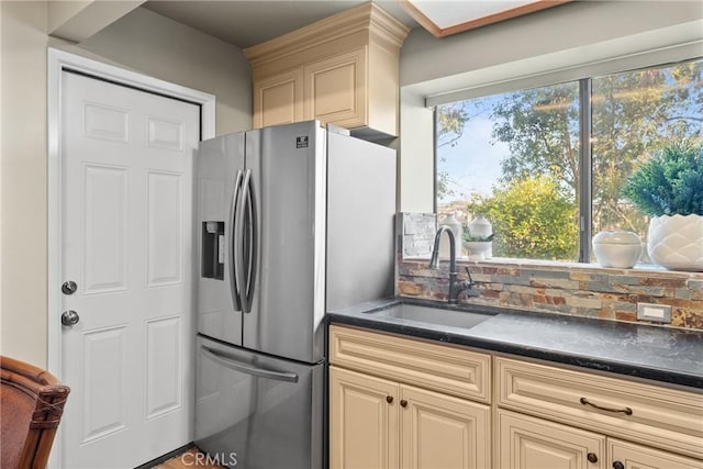 21340 Via Del Puma, Yorba Linda, CA 92887 - kitchen with stainless steel fridge with ice dispenser, dark countertops, tasteful backsplash, and cream cabinetry
