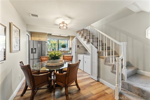 21340 Via Del Puma, Yorba Linda, CA 92887 - dining area with washing machine and dryer, stairway, and light wood-style floors