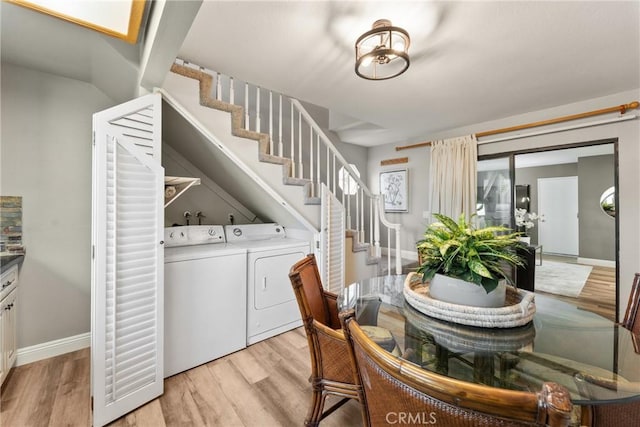 21340 Via Del Puma, Yorba Linda, CA 92887 - dining space featuring stairs, washing machine and dryer, and light wood-style floors