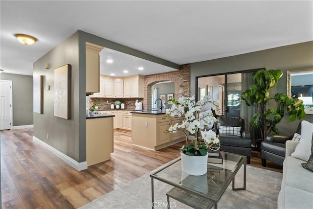 21340 Via Del Puma, Yorba Linda, CA 92887 - living room with arched walkways, light wood-type flooring, and recessed lighting