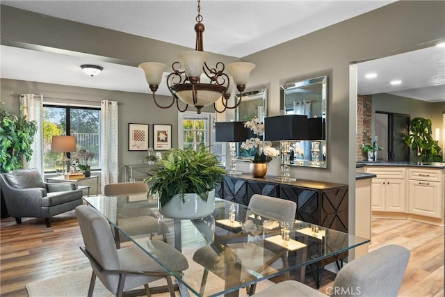 21340 Via Del Puma, Yorba Linda, CA 92887 - dining area featuring plenty of natural light, light wood-style floors, and a chandelier