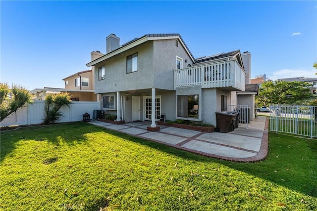 21340 Via Del Puma, Yorba Linda, CA 92887 - rear view of property featuring a chimney, a patio area, stucco siding, and a fenced backyard
