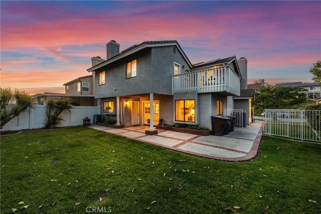 21340 Via Del Puma, Yorba Linda, CA 92887 - rear view of house with a chimney, a patio, stucco siding, and a fenced backyard