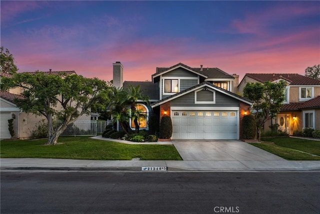 21340 Via Del Puma, Yorba Linda, CA 92887 - traditional-style home featuring driveway, a chimney, and an attached garage