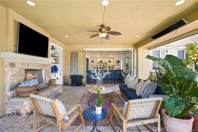29291 Via Zamora, San Juan Capistrano, CA 92675 - view of patio / terrace featuring an outdoor living space with a fireplace and a ceiling fan