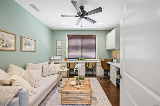 living area with dark wood-style flooring, a ceiling fan, recessed lighting, and visible vents