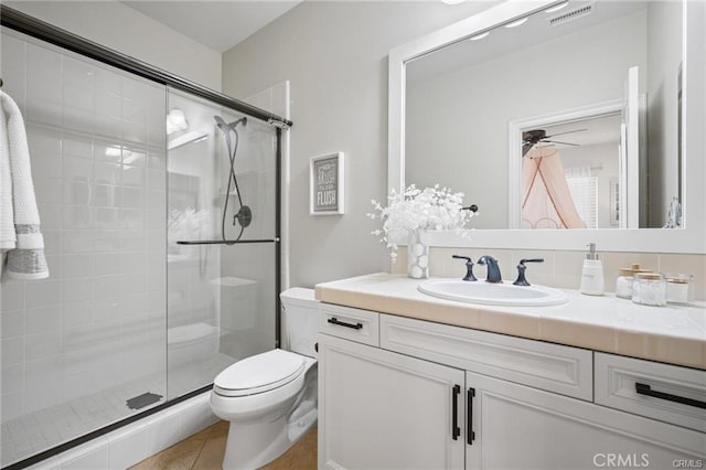 29291 Via Zamora, San Juan Capistrano, CA 92675 - bathroom featuring toilet, vanity, a shower stall, and ceiling fan