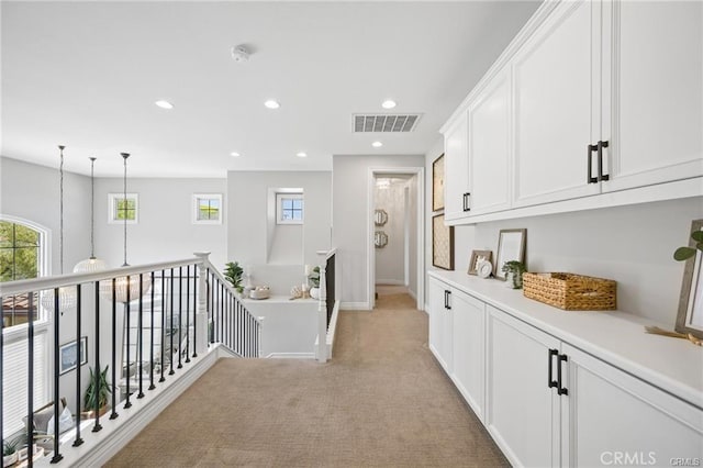 29291 Via Zamora, San Juan Capistrano, CA 92675 - hallway with light colored carpet, recessed lighting, baseboards, and an upstairs landing